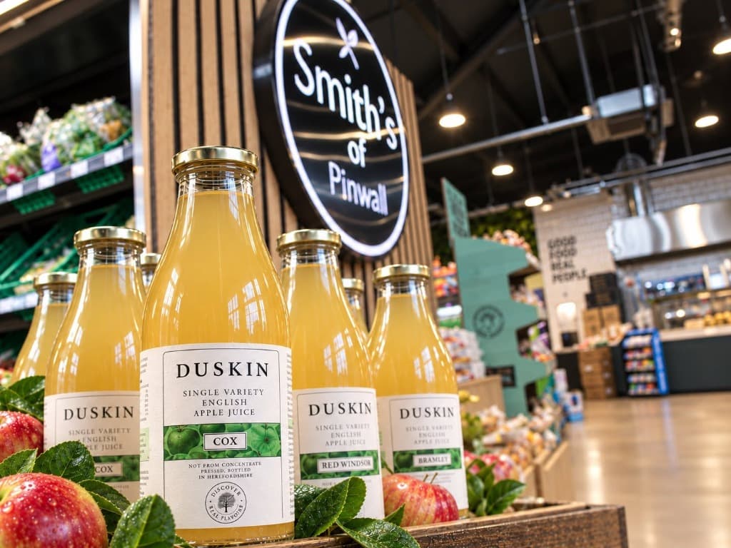Smiths of Pinwall Duskin English Apple Juice product photography with branded timber backdrop