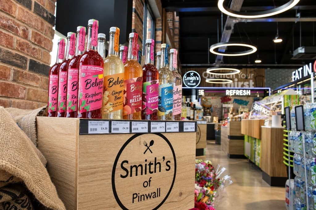 Smiths of Pinwall Belvoir Farm artisanal drinks crate display with branded logo and cafe signage